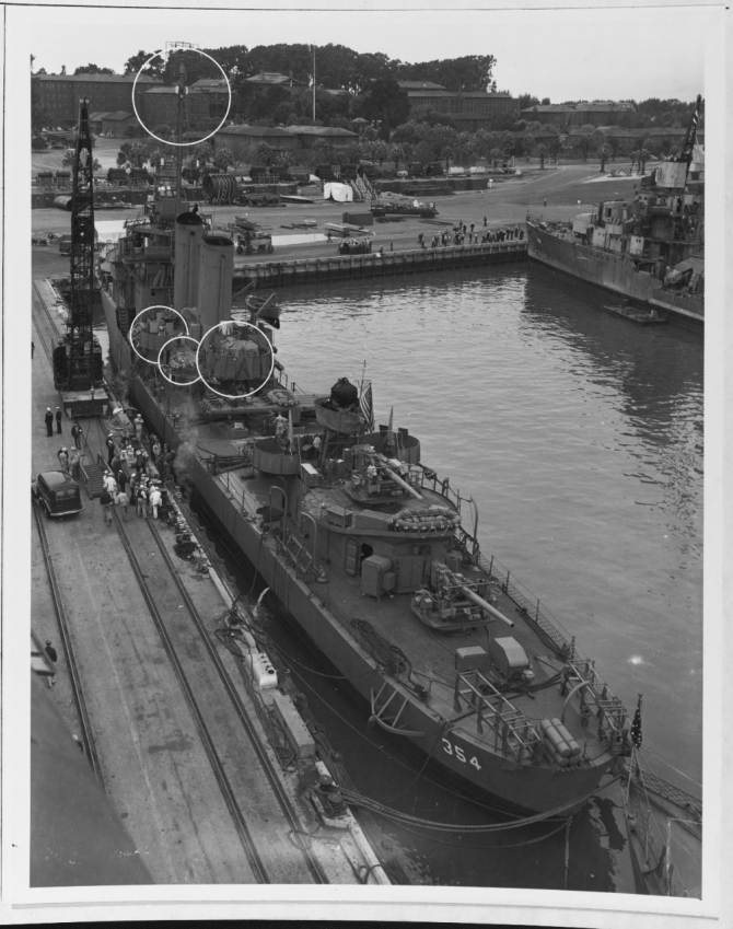 Monaghan moors at Mare Island Navy Yard, 13 October 1942. Note the details of the early model 5-inch mounts aft. The circles point out the modifications just made to the destroyer. Ralph Talbot (DD-390) is in the background. (U.S. Navy Bureau of Ships Photograph 19-N-35831, National Archives and Records Administration, Still Pictures Branch, College Park, Md.)