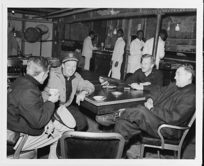 Capt. Bertram J. Rodgers (right), Salt Lake City’s commanding officer, his executive officer, and navigator, and Monaghan’s torpedo officer, relax in the cruiser’s wardroom and discuss the battle at Dutch Harbor, Alaska, after the action. (U.S. Navy Photograph 80-G-50209, National Archives and Records Administration, Still Pictures Branch, College Park, Md.)
