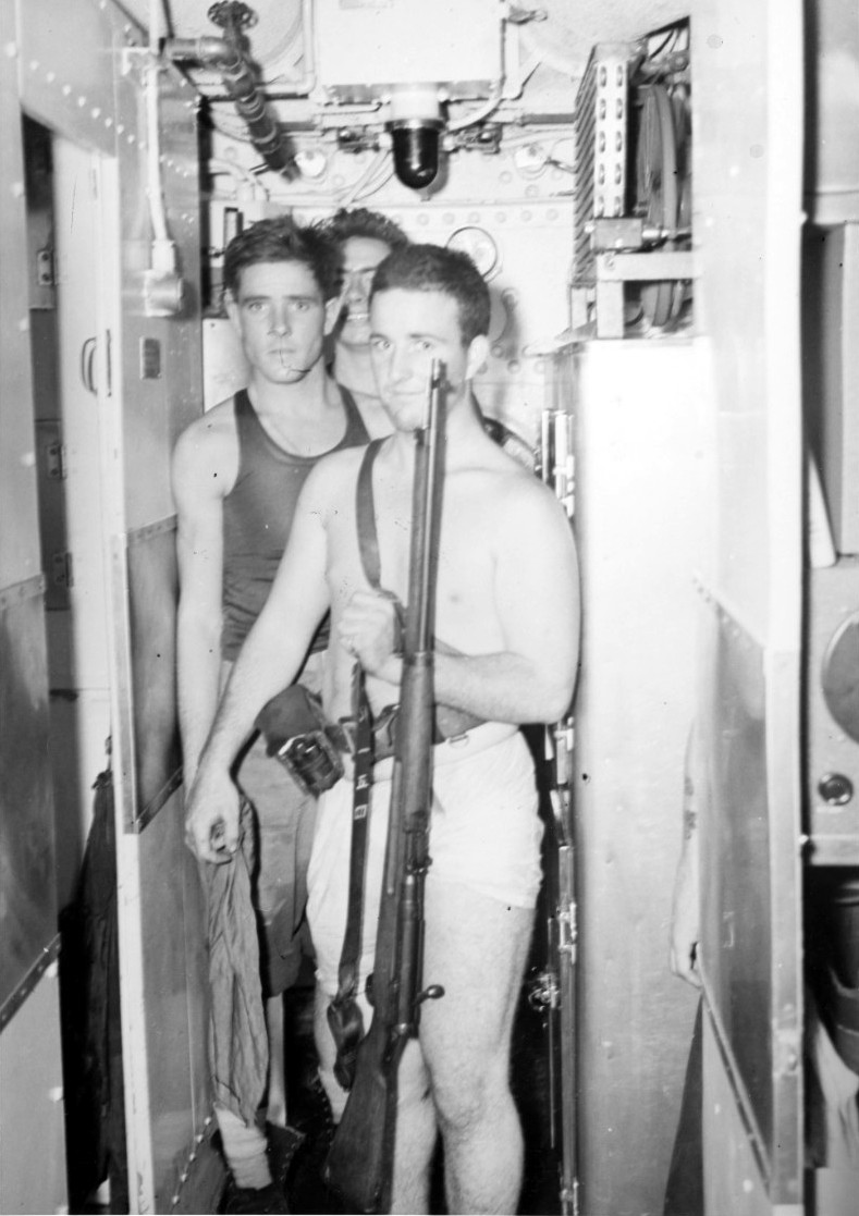 Among these returning raiders from Makin Island on 18 August 1942 is this leatherneck who hefts a Japanese rifle captured during the raid. (U.S. Navy Photograph 80-G-11728, National Archives and Records Administration, Still Pictures Division, Co...
