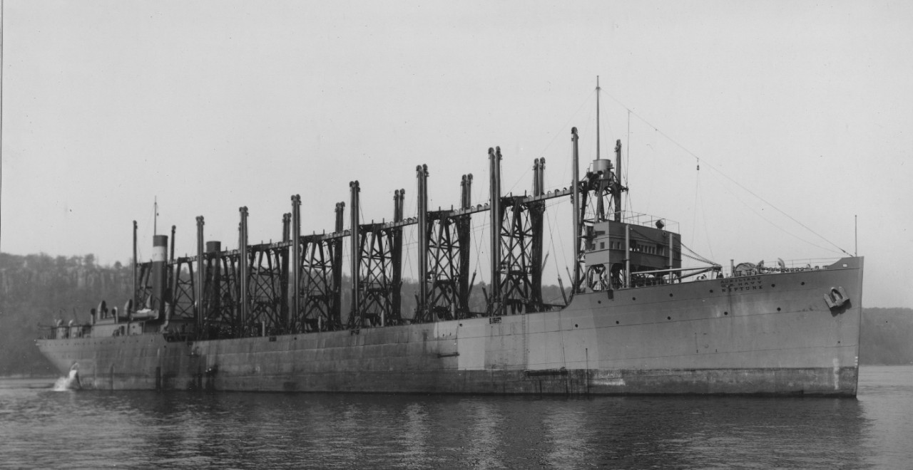 Neptune, New York City, 3 October 1911. Note athwartships funnel arrangement, details of the extensive coal-handling gear, the words AUXILIARY U.S. NAVY NEPTUNE just below her foc’sle deck, as well as the painting stages over the side, indicating...