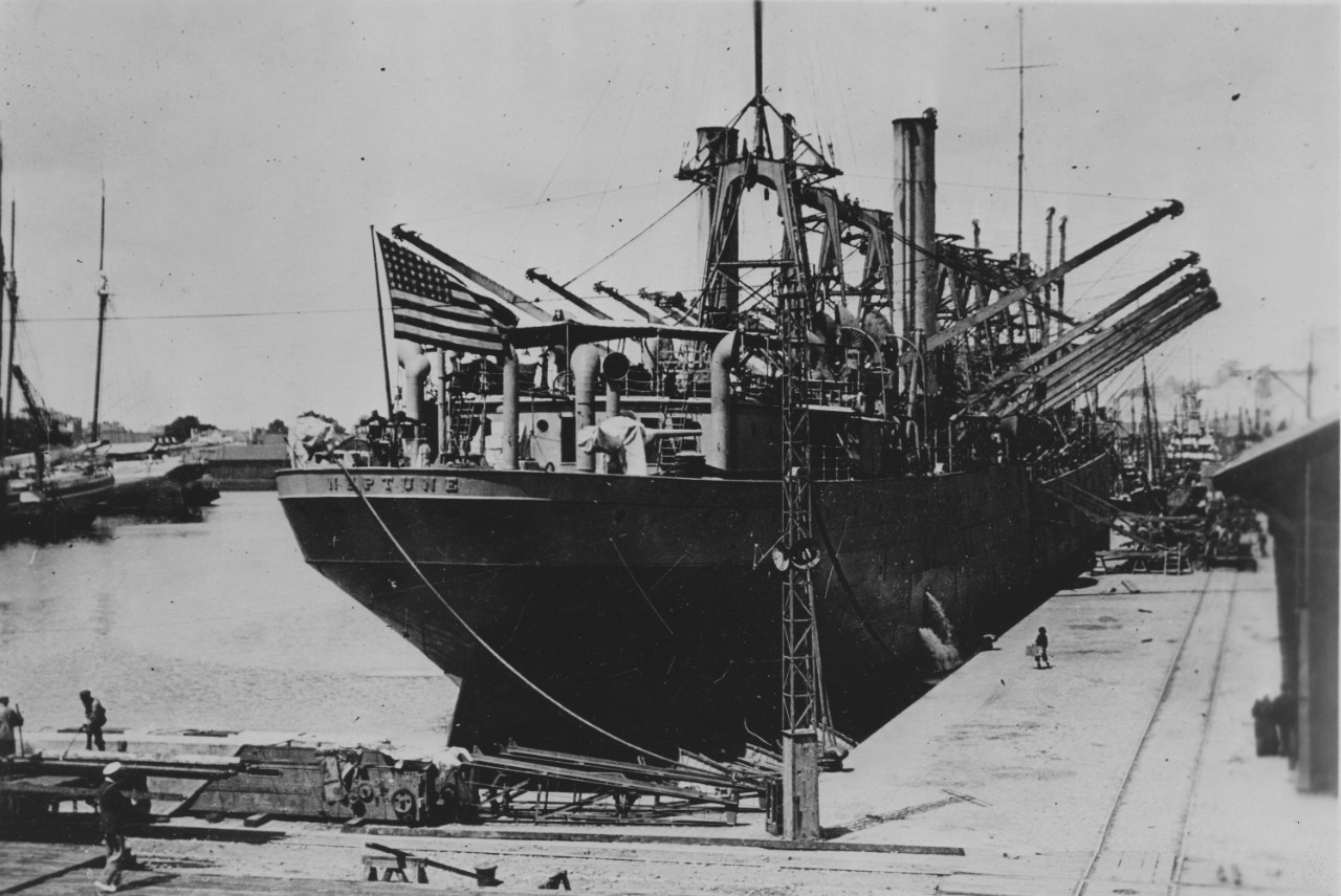 Neptune, her name clearly emblazoned on her stern in raised steel letters, lies moored at St. Nazaire, France, in June 1917. (U.S. Army Signal Corps Photograph 111-SC-95451, National Archives and Records Administration, Still Pictures Branch, Col...