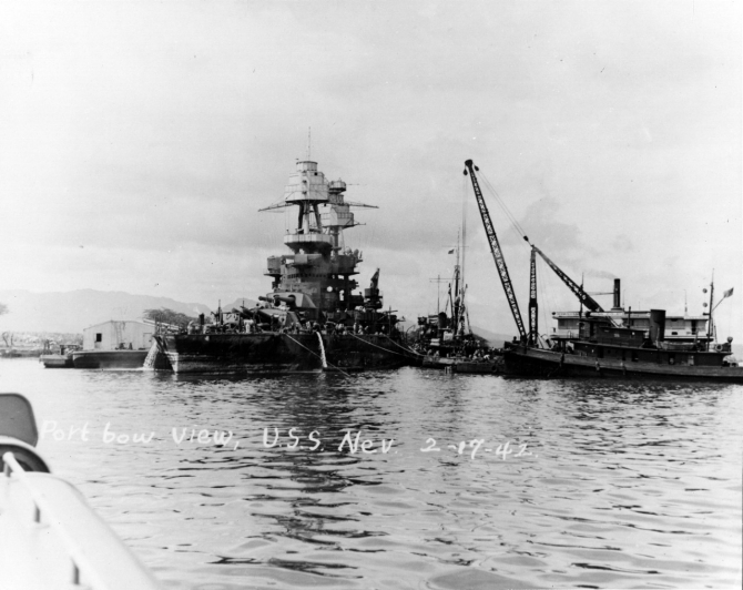 The Hawaiian Dredging Company crane barge Gaylord and other ships assist Nevada as she is prepared for drydocking at the Pearl Harbor Navy Yard, 17 February 1942. Collection of Vice Adm. Homer N. Wallin. (Naval History and Heritage Command Photograph NH 50106)