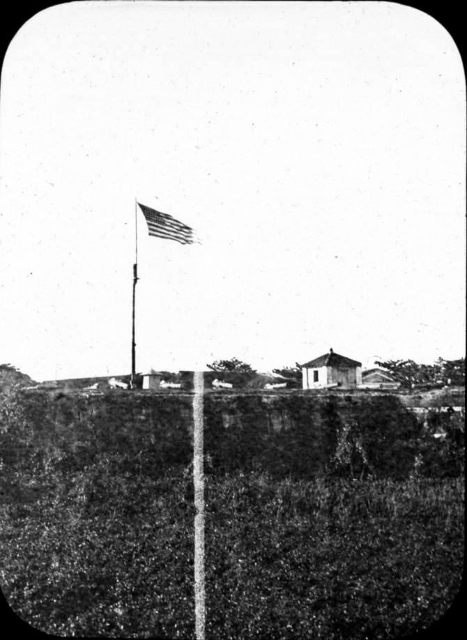 The Americans raise Olympia’s flag over Manila, 13 August 1898. (Donated by the estate of Lt. C.J. Dutreaux, unattributed or dated U.S. Navy Photograph WHI.2014.38, Photographic Section, Naval History and Heritage Command)