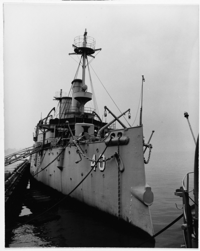 The stripped-down ship rests serenely at her moorings at Philadelphia Naval Shipyard, 1957. (Courtesy of the Cruiser Olympia Association, 17 January 1958, U.S. Navy Photograph NH 43278, Photographic Section, Naval History and Heritage Command)
