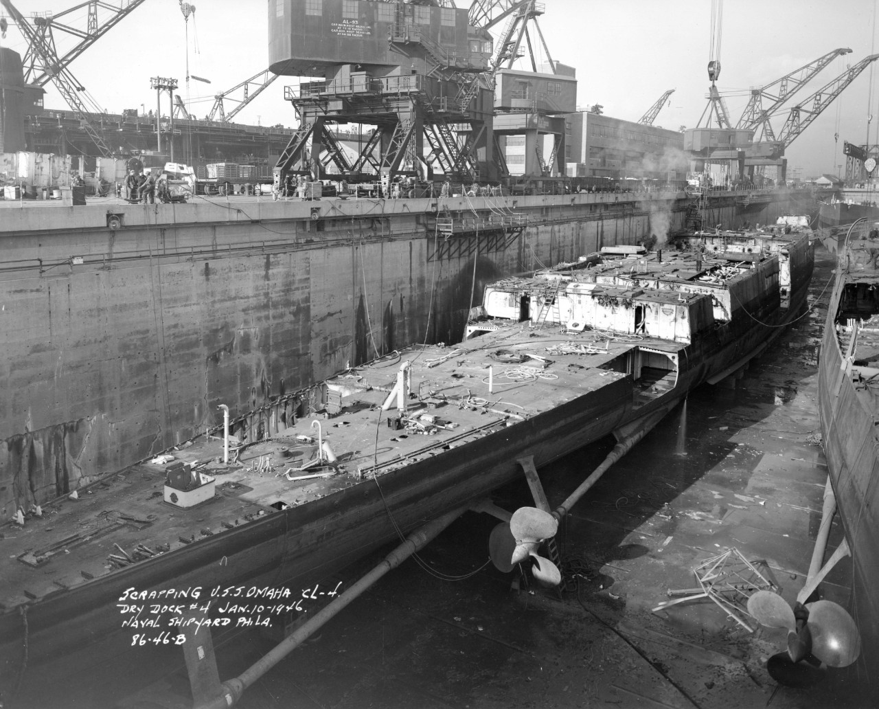 Scrapping ex-Omaha proceeds at the Philadelphia Naval Shipyard, 10 January 1946, a process being carried out on two of her sisters (R) in the same dry dock. (Ships History Files, Naval History and Heritage Command, History and Archives Division)