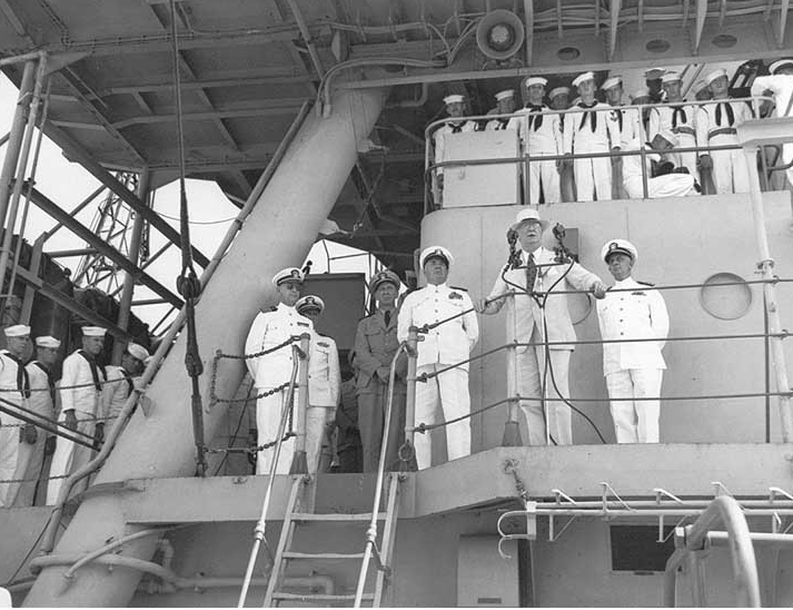 Secretary of the Navy Frank Knox, accompanied by Vice Adm. Jonas H. Ingram, addresses Omaha’s crew, 4 October 1943, at Recife. (U.S. Navy Photograph 80-G-54197, National Archives and Records Administration, Still Pictures Branch, College Park, Md.)