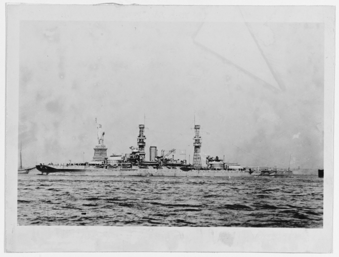 Pennsylvania in New York Harbor with the Statue of Liberty beyond her, during the early 1920s. Note planes atop her turrets, and short-range battle practice target rigged amidships. (Naval History and Heritage Command Photograph NH 42742) 