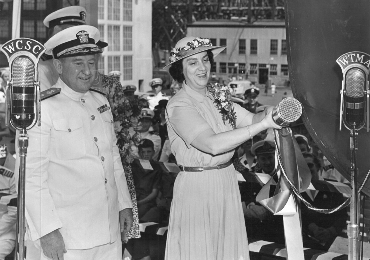 Mrs. Cordelia P. Kane prepares to christen Pringle (DD-477) at the Charleston (S.C.) Navy Yard, as Rear Adm. William H. Allen stands by to assist, 2 May 1942. (USS Pringle, Ship Naming File Box 172, Naval History and Heritage Command)