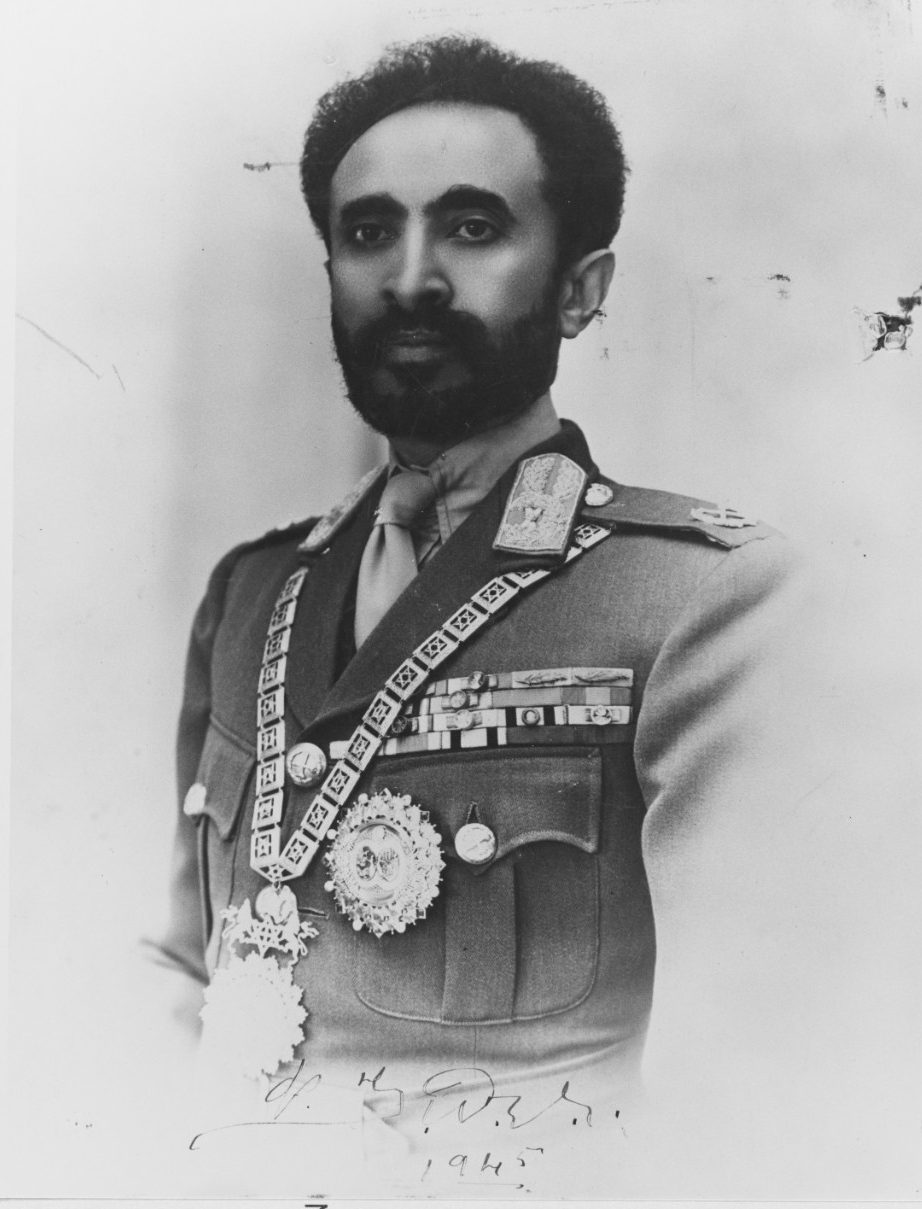 Emperor Haile Selassie signs and presents this picture to Quincy during his visit, 13 February 1945. (Naval History and Heritage Command Photograph NH 82514)