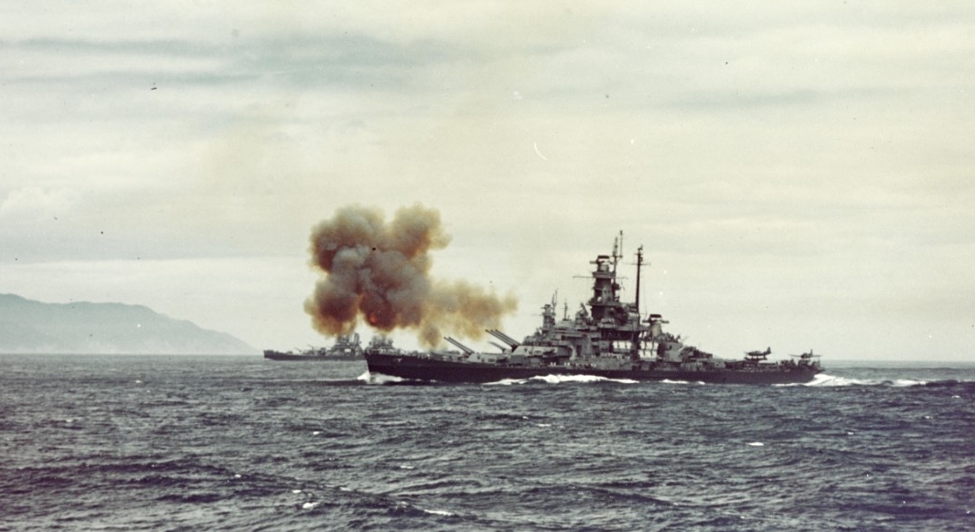 South Dakota fires her forward 16-inch guns of Turrets I and II at the Kamaishi Steel Works on Honshū, Japan, 14 July 1945. The heavy cruiser in the left distance is either Quincy or Chicago. (U.S. Navy Photograph 80-G-K-6035, National Archives a...