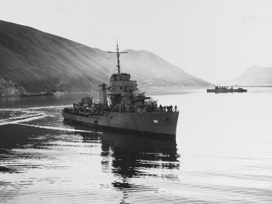 Reid at Dutch Harbor, T.A., on 6 September 1942, with Japanese prisoners of war from submarine RO-61, which Reid had sunk on 31 August 1942. (U.S. Navy Photograph 80-G-215364, National Archives and Records Administration, Still Pictures Division,...
