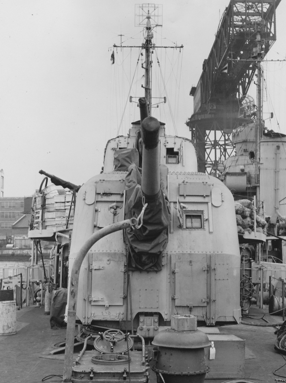 Looking forward from Rhind’s fantail during an availability at the New York Navy Yard, 30 November 1943. Note the unstowed provisions on the deck around Mt. 53, and the details of Mt. 54 in the foreground. (U.S. Navy Bureau of Ships Photograph BS...