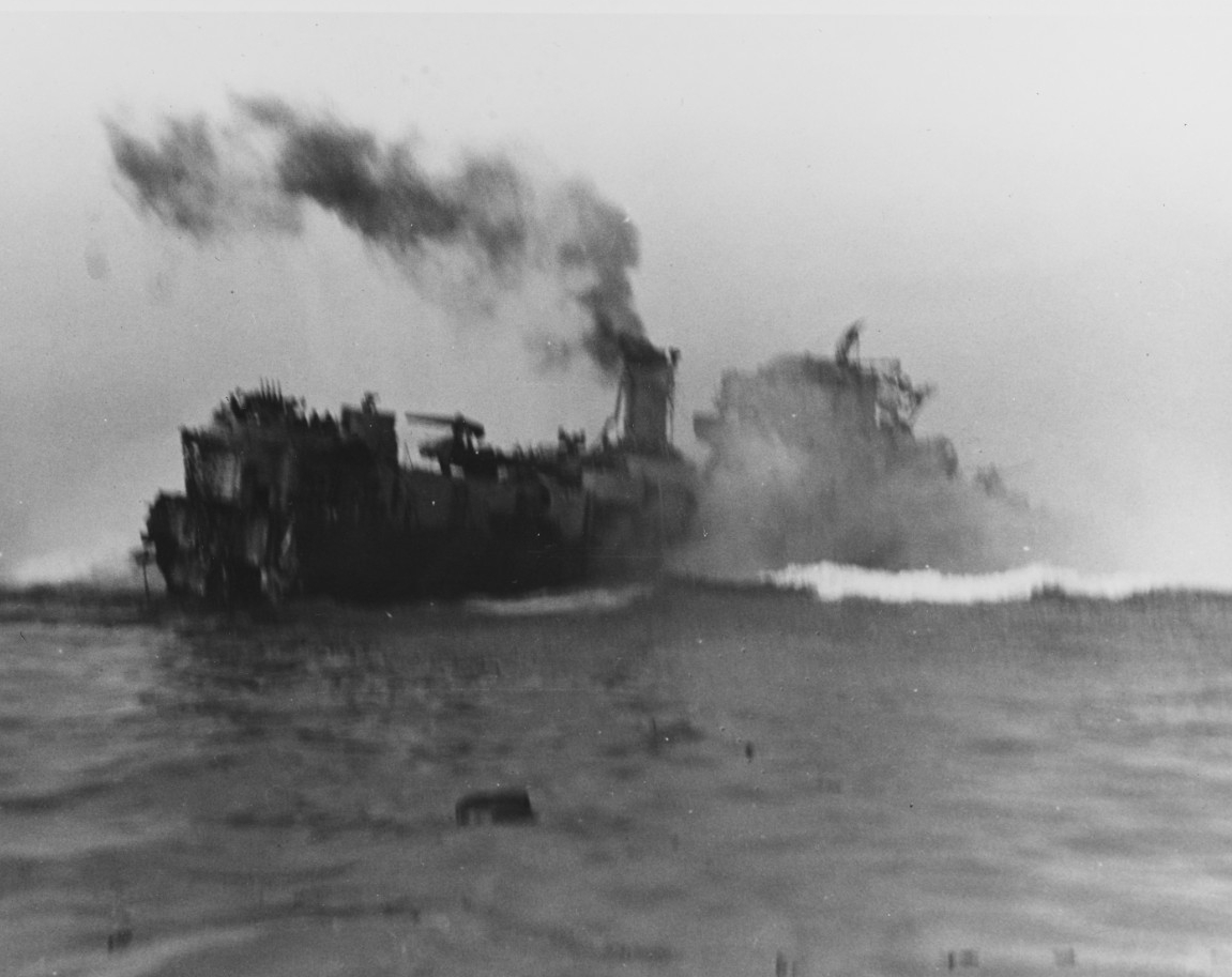 Rich striking a mine, amidships, while operating off Utah Beach on 8 June 1944. Just moments before she had hit another mine, which severed her stern. (Naval History and Heritage Command Photograph NH 44312)
