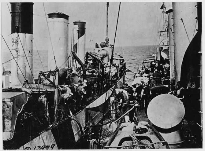 Roe, at right, oiling from Warrington (Destroyer No. 30), at sea off  Brest, France on 1 June 1918. Note Warrington's “dazzle” camouflage. (Naval History and Heritage Command Photograph NH 41760)