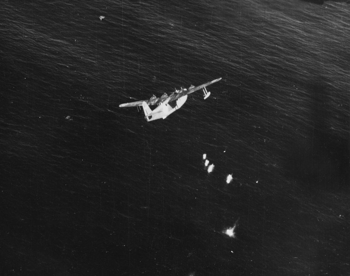 Lt. Guy M. Thompson Jr., of Patrol Bombing Squadron (VPB) 116 flies a Consolidated PB4Y-1 to protect Salmon during her return voyage, and detects and shoots down this Japanese Kawanishi H8K2 Type 2 flying boat Emily about 40 miles from the crippl...