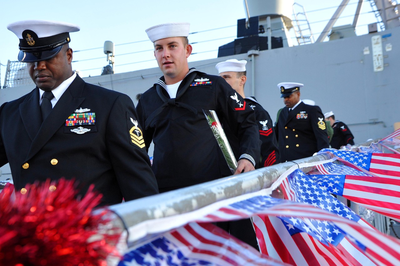 Sailors walk down the gangway to reunite with their loved ones at Mayport when Samuel B. Roberts returns from a deployment to the Mediterranean, Red Sea, Horn of Africa, and Indian Ocean, 14 December 2011. (MC2 Jacob Sippel, U.S. Navy Photograph ...