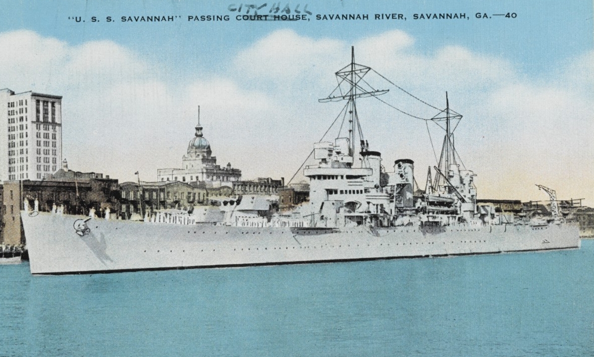 A postcard picture shows the ship as she passes City Hall to starboard while visiting Savannah, Ga., on her shakedown cruise, 1938. (U.S. Navy Photograph NH 108695, Naval History and Heritage Command)