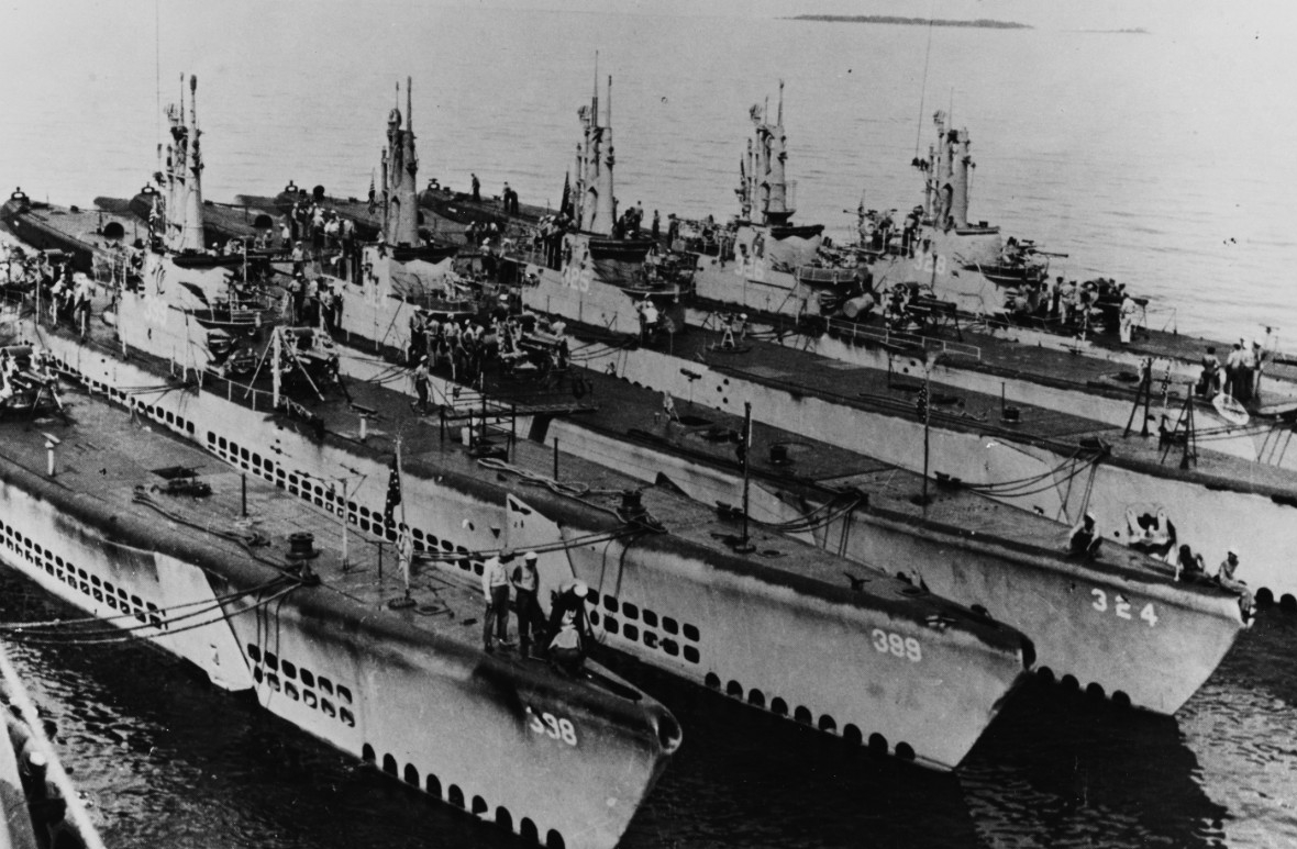 Six boats of Submarine Squadron Five (SubRon 5) nested at Guam, between Segundo’s second and third war patrols. She can be seen all the way to the bottom left of the photo. They are (from left to right): Segundo, Sea Cat (SS-399), Blenny (SS-324)...