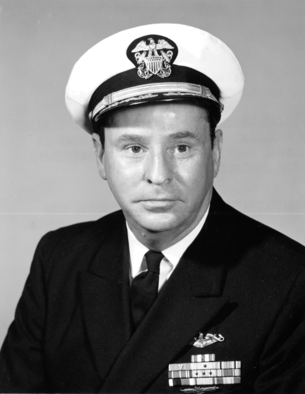 Lt. Cmdr. Stephen L. Johnson graduated from the United States Naval Academy in 1939 and served in battleship Oklahoma (BB-37) until June 1940. He went to submarine school shortly before the war began and served in Shad as gunnery officer before s...