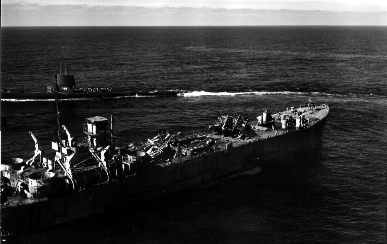 Segundo, her men on deck to view the destruction (note portions of the upper deck torn and blown upwards), passes close aboard ex-LST-482, 29 February 1956. (U.S. Navy Photograph 80-G-688137, National Archives and Records Administration, Still Pi...