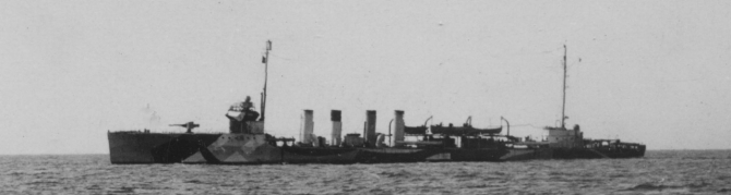 Shaw at sea, 18 May 1918, as photographed by Pvt. C. D. Donnelly, Signal Corps, from Whipple (Coast Torpedo Vessel No. 15). Although cropped from a larger image, this view of the ship shows that a shield has been added to the forward 4-inch mount, that the 1-pounder has been removed from its position forward of the bridge, and that depth charge tracks have been installed on the fantail.  Also note position of her identification number (68) on then hull directly beneath the bridge. (U.S. Army Signal Corps Photograph 111-SC-13475, National Archives and Records Administration, Still Pictures Branch, College Park, Md.)