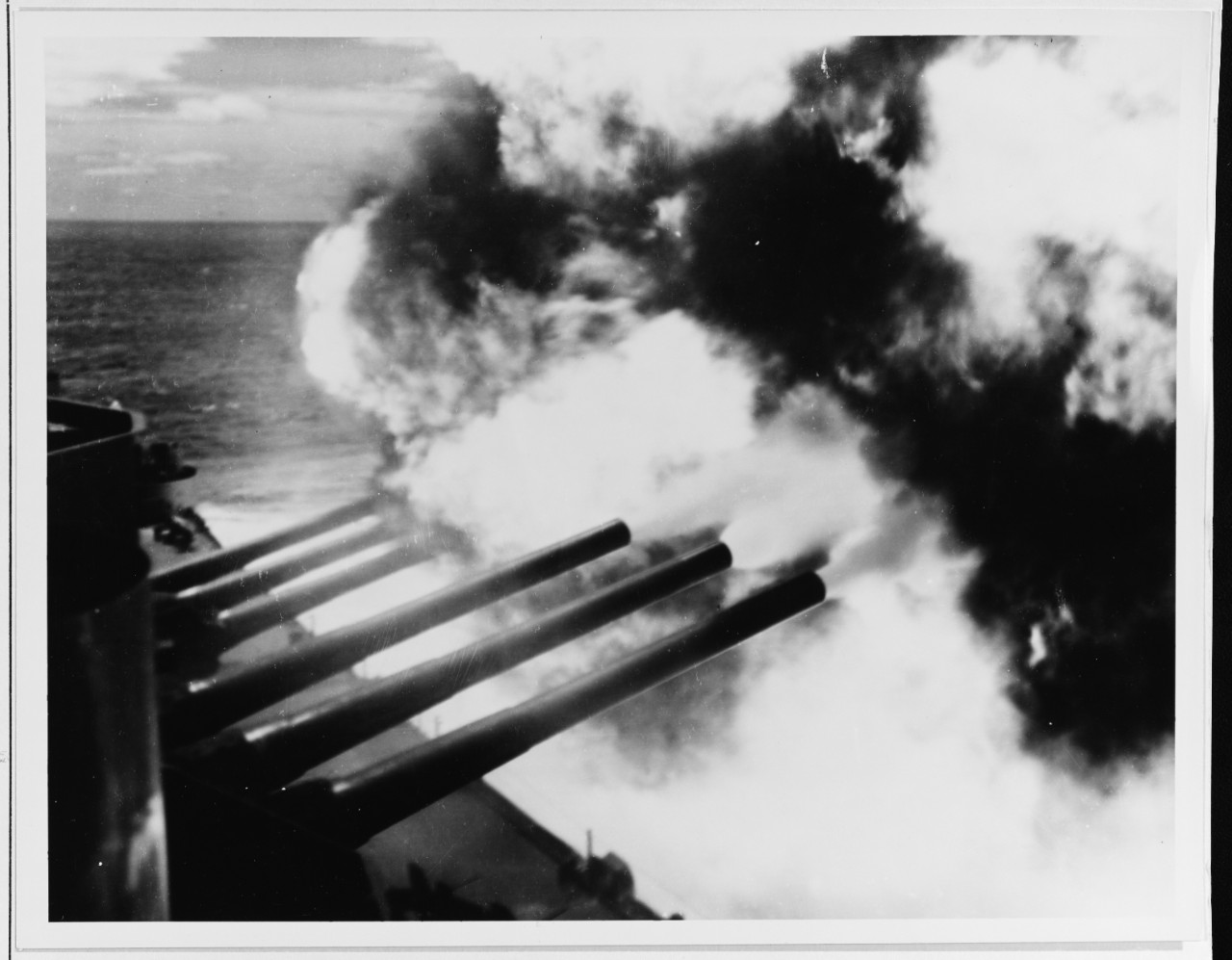South Dakota fires her forward 16-inch guns of Turrets I and II at the Kamaishi Steel Works on Honshū, Japan, 14 July 1945. (National Archives Photograph 80-G-490175, Still Pictures Branch, National Archives & Records Administration, College Park...