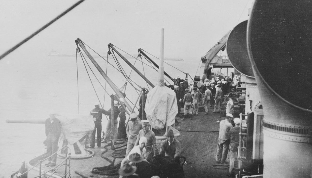 Sailors rig the ship for coaling, October 1918. (U.S. Navy Photograph NH 108528, Naval History and Heritage Command)