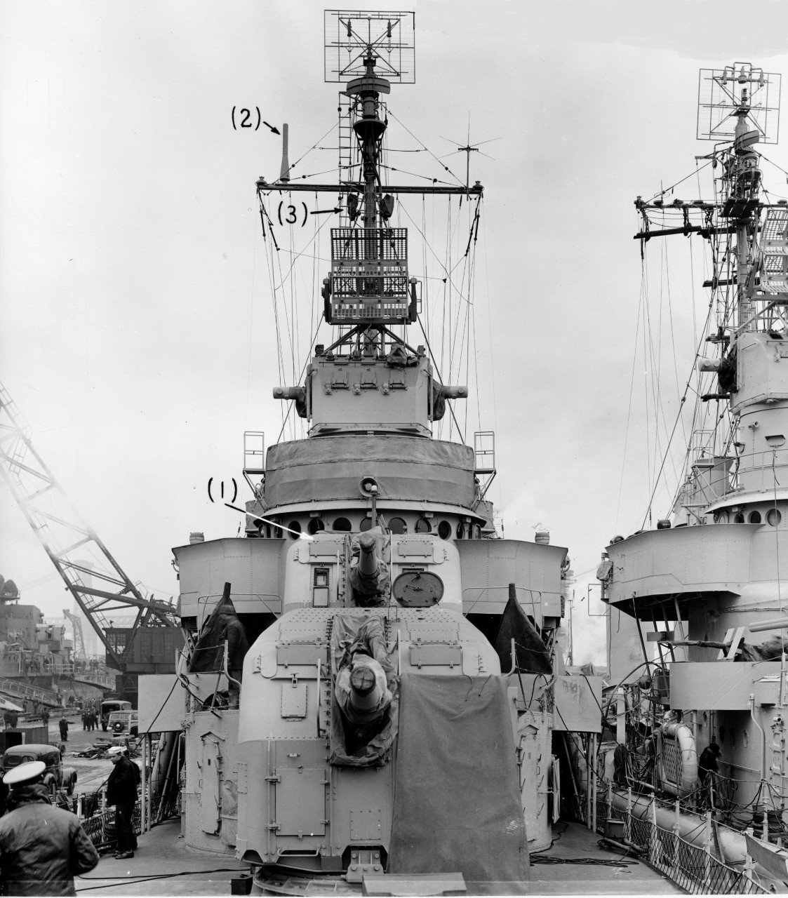 Strong at the New York Navy Yard three days before Christmas of 1942, Mt. 51 and Mt. 52 of her main battery prominent in the foreground. Parenthetical numbers refer to recent modifications: (1) the raised platform and foundation for a 20-millimet...