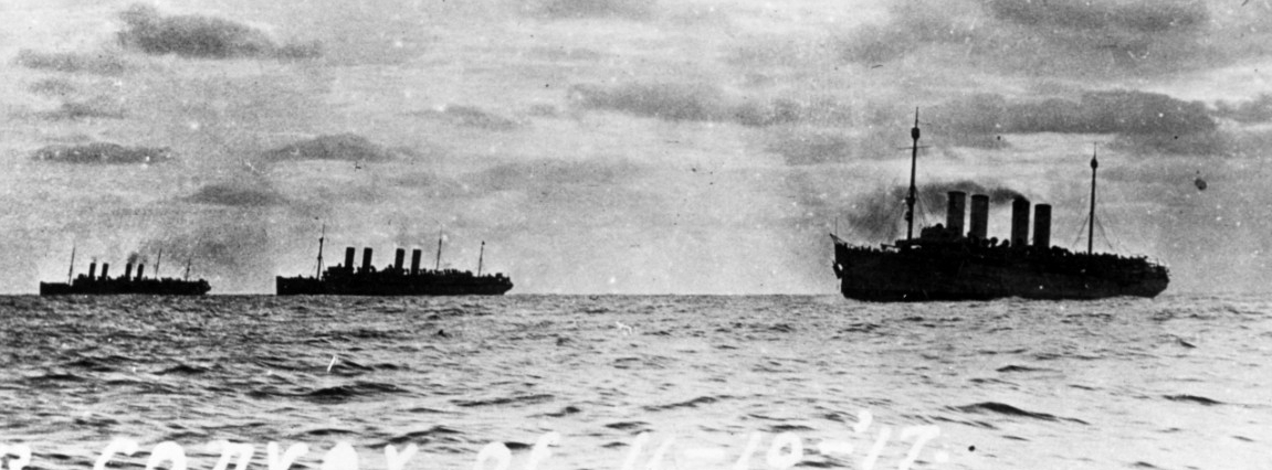 Transports steaming in convoy from New York City to Brest, France, on 10 November 1917. The ships are (from left to right): Mount Vernon (Id. No. 4508), Agamemnon (Id. No. 3004) and Von Steuben. Note the damage to Von Steuben's bow, the result of...