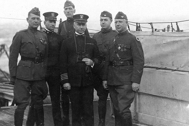 Von Steuben’s commanding officer, Capt. Cyrus R. Miller, (center) with Cmdr. John W. Wilcox, Jr., his executive officer, and four Army officers, while at sea en route across the Atlantic Ocean to the United States, circa March 1919. Capt. Miller ...