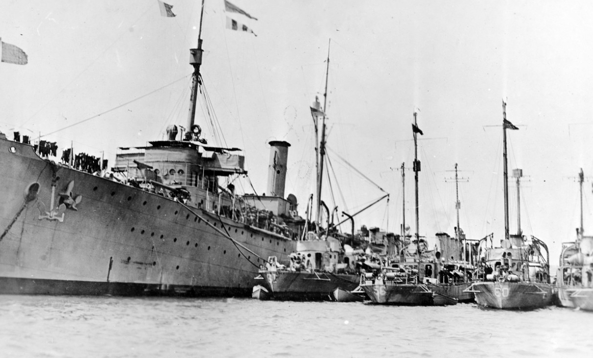 Melville tending destroyers at Queenstown, 1917. The destroyers present include (from left to right): Jacob Jones (Destroyer No. 61); Ericsson (Destroyer No. 56); Wadsworth; and an unidentified ship. (Naval History and Heritage Command Photograph...