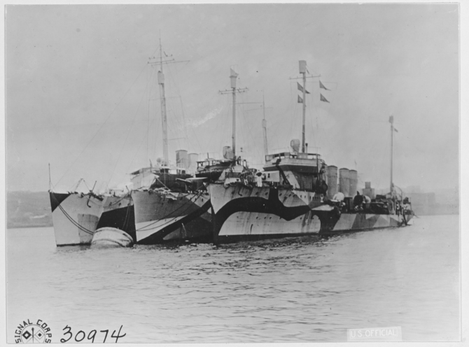 Wainwright, Winslow (Destroyer No. 53), and Bell (Destroyer No. 95) listed from right to left Moored to a buoy in the inner harbor of Brest, France on 27 October 1918. Note the various pattern camouflage designs worn by these three ships. (U.S. Army Signal Corps Photograph, Naval History and Heritage Command, NH 41513).