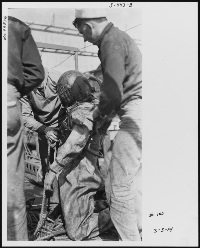 Diver preparing to go over the side of Walke on 3 March 1914. Note the airline attached to the back of his helmet. (U.S. Naval History and Heritage Command Photograph NH 99836, courtesy of Jim Kazalis, 1981)