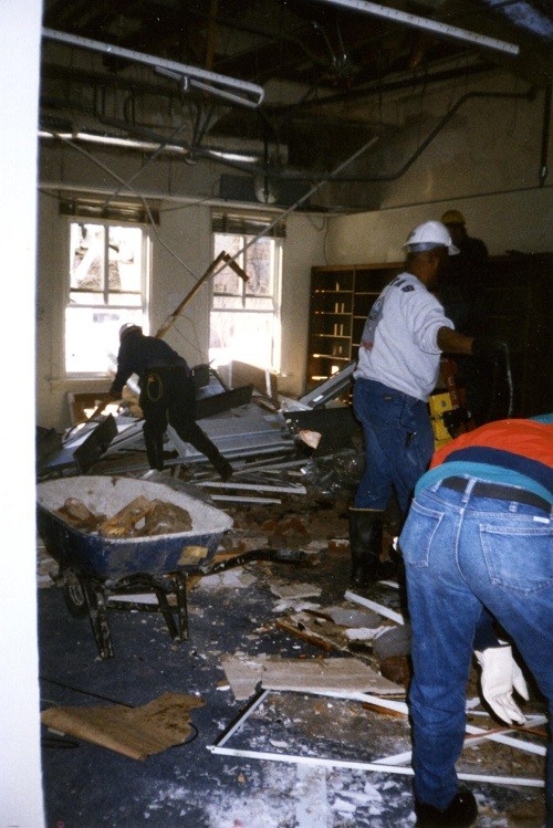 Aftermath of the chimney falling through the roof of the reference room (Bldg. 44) of Navy Department Library, January 1996.