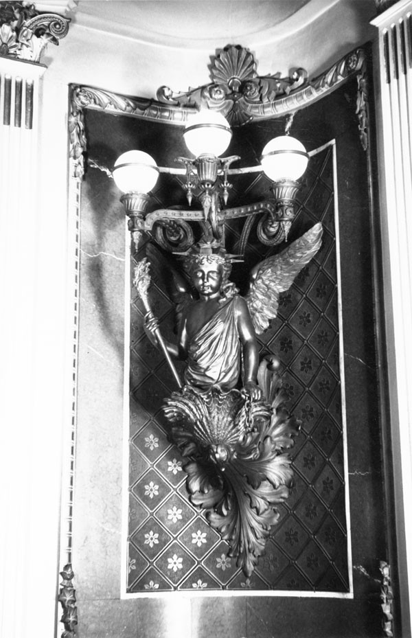 Detail of corner lighting fixture in the former library of Navy Department, showing a figure representing Liberty. Photograph taken by Richard Cheek, summer 1976, for the Dunlap Society.