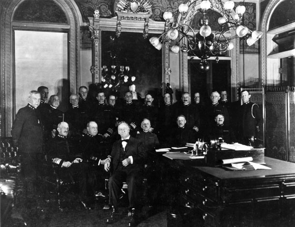 View of the office of Secretary of the Navy, east wing, showing Secretary Josephus Daniels with officers. Photograph by the Navy Department, taken between 1913-1918. Collection: National Archives and Records Administration. Audiovisual; photo no....