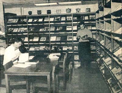 One of many scholars researches an article for the Naval Institute in the Navy Department Library's periodicals section. 