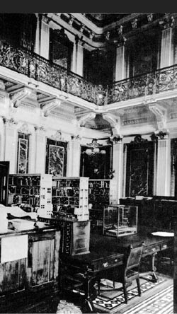 Navy Department Library was located in the State, War, and Navy Building, 17th and Pennsylvania Avenue NW. This room was called the Indian Treaty Room, photographed circa 1915.