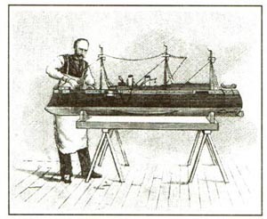 Image of a man working on a ship model.