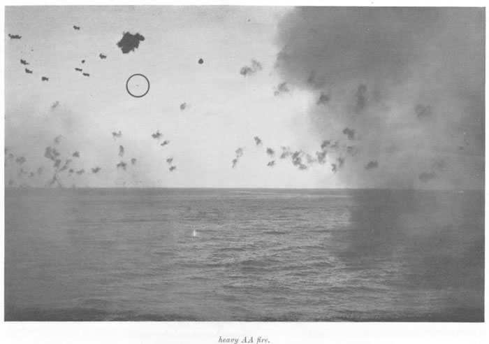 Another illustration of a good safe distance to keep enemy planes. Japanese plane (believed "Zeke") approaching formation under heavy AA fire.