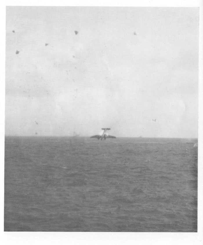 Japanese "Irving" (shown in preceding picture) hit and burning; plunges seaward after receiving additional hits.