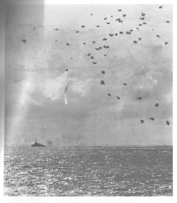 Enemy plane shot down by ship's AA within formation.