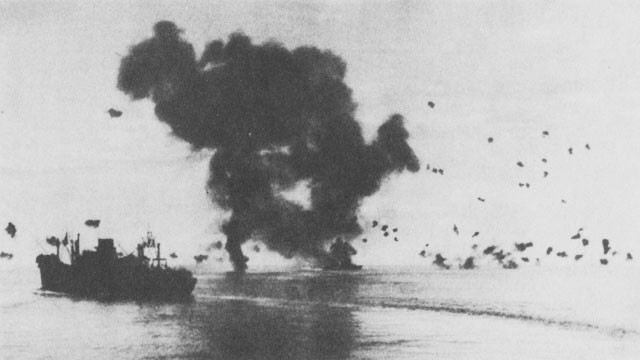 Air Attack of 12 November. Burning torpedo plane (left center) has crashed into the San Francisco (right center). Left foreground, President Jackson.