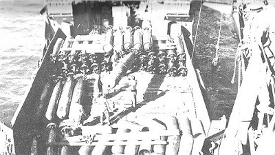 Image of Torpedoes being hoisted aboard Lexington.