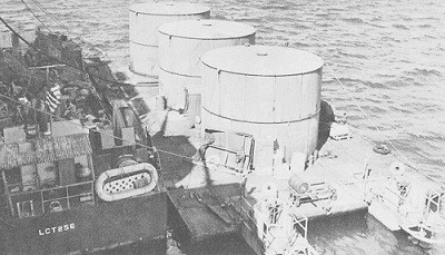 Image of a gasoline lighter and an LCT alongside the carrier Intrepid.
