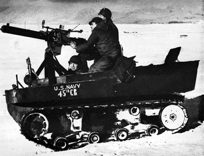 Seabees Manning an Anti-aircraft Machine Gun Mounted on Tractor. 