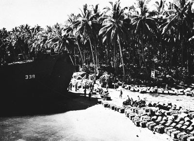 Unloading Gas and Oil Drums on the Beach at Bougainville. 