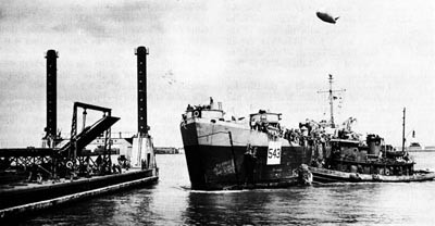 LST Moves in to Secure to a Leibnitz Pier, OMAHA Beach. 
