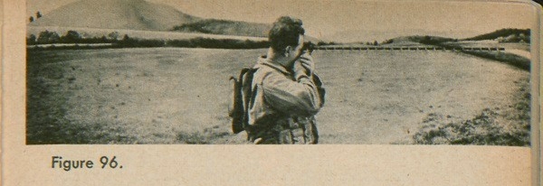 Figure 96: A soldier using a compass to get the azimuth.