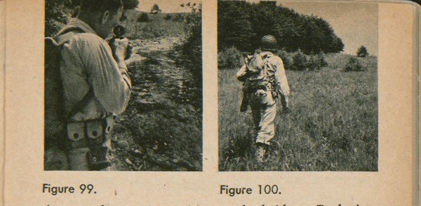 Figure 99: A soldier setting his sight with a compass. Figure 100: A soldier walking towards his destination. 